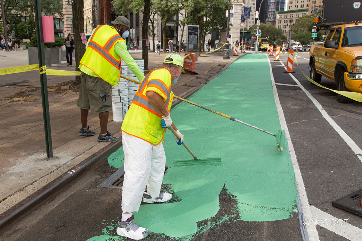 Crew painting a bike lane