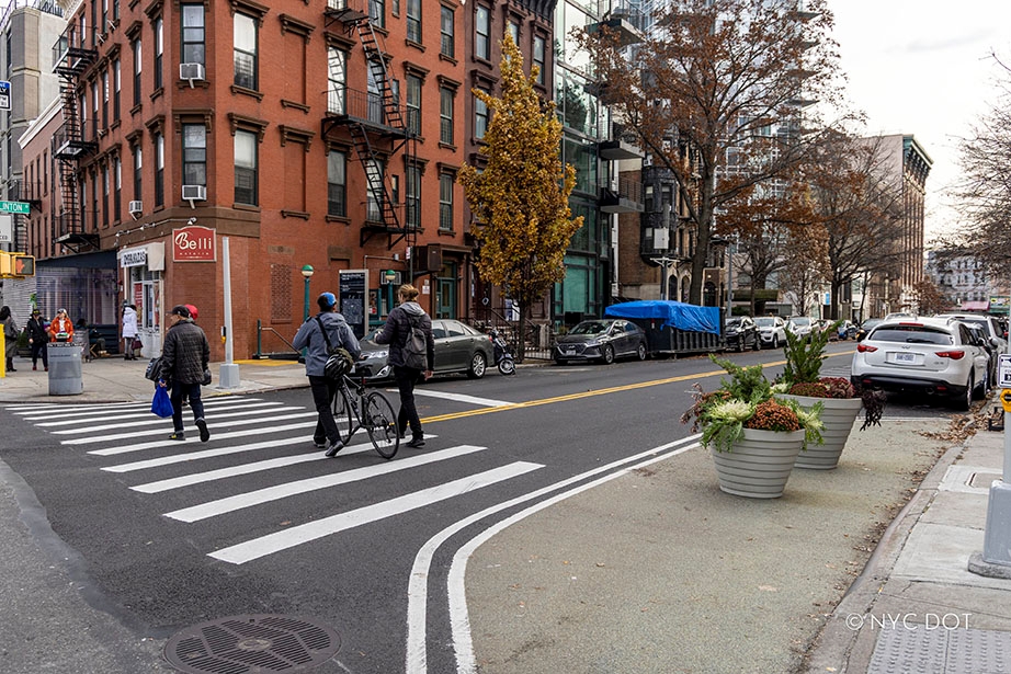 Groups of people crossing a street